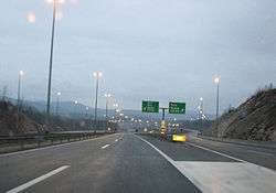 An exit leading to the A6 motorway, as seen from the A1.