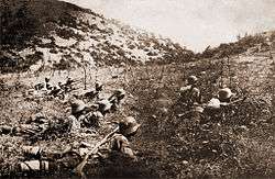 Photograph of Bulgarian soldiers cutting enemy barbed wire during World War I