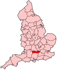 A map of a country, divided into many smaller counties. One county, situated in a southern-central location, is highlighed in red