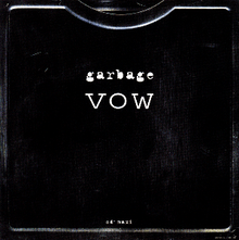 A black metal-like box, with the title "Garbage - Vow" atop it.
