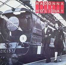 The black-and-white picture of the engine of a train. A symbol of a white arrow is present at the center of the engine's front. The words "Golden Arrow" are written on the arrow. A couple walks beside the engine on the platform, the man carrying a suitcase. On the top-right corner of the image, the words "Madonna" and "Holiday" are written in white, on bright red stripes.