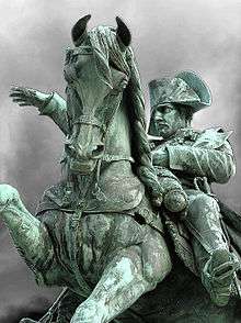 Photo of a statue of Napoleon on a horse.