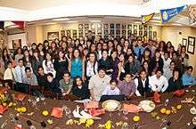 Dr. Nicholas and Judge Mandel join NAC I and II students at the second annual Thanksgiving celebration.