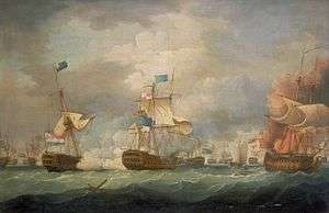 On a stormy sea beneath towering clouds, a number of sailing warships battle. In the foreground are three ships, two to the right of the frame bridged by clouds of smoke and the mainmast of the far right ship, which bears a prominent horizontally-striped flag is toppling. To the left of the frame a third ship drifts as flames leap from her deck.